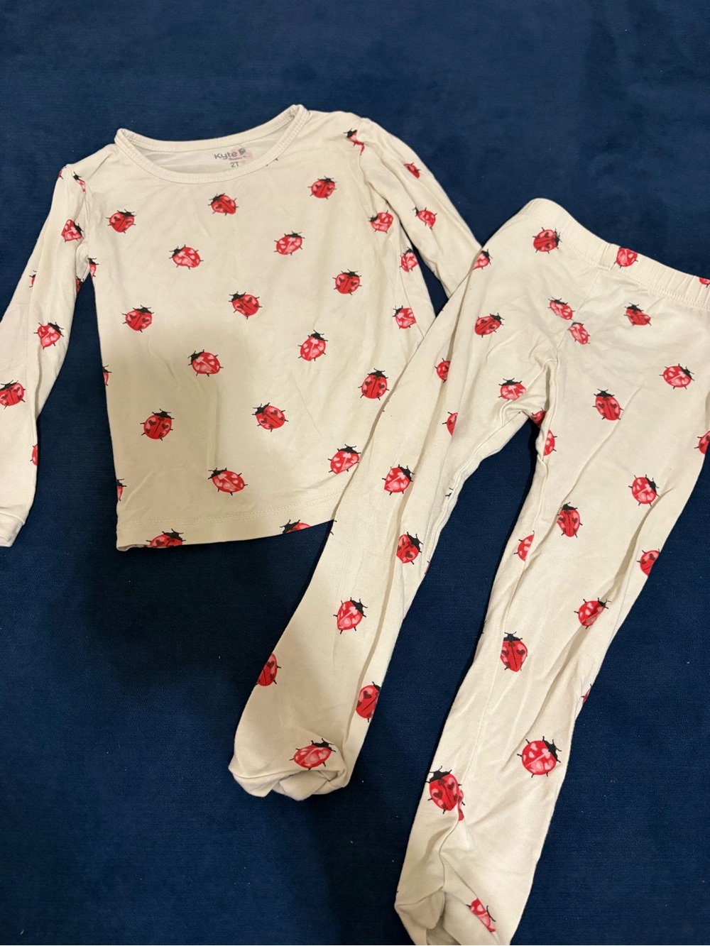 Kyte BABY Cream Pajama Set with Red Ladybug Print